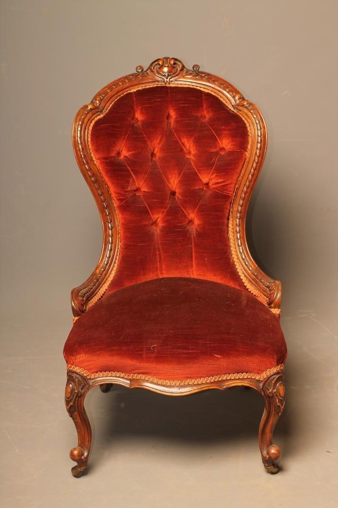 A VICTORIAN WALNUT FRAMED NURSING CHAIR of spoonback form Image