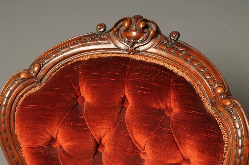 A VICTORIAN WALNUT FRAMED NURSING CHAIR of spoonback form Image