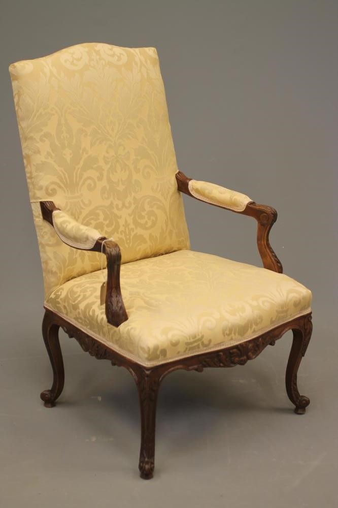 A FRENCH CARVED WALNUT ARMCHAIR Image
