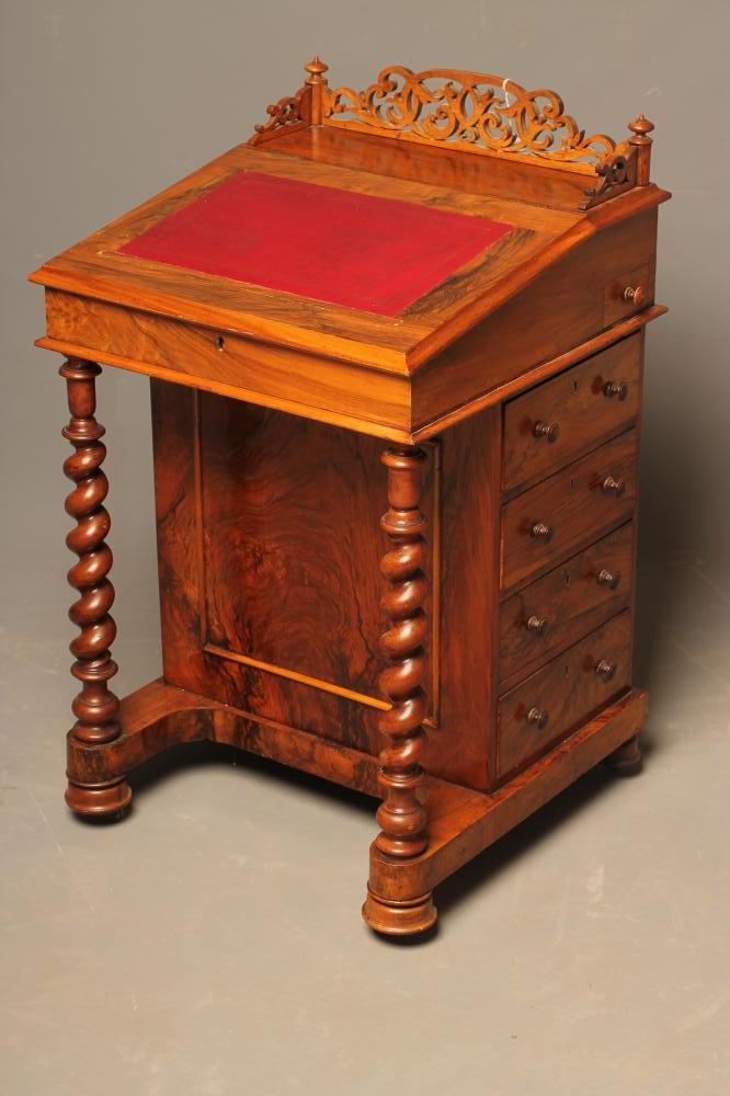 A VICTORIAN WALNUT DAVENPORT Image