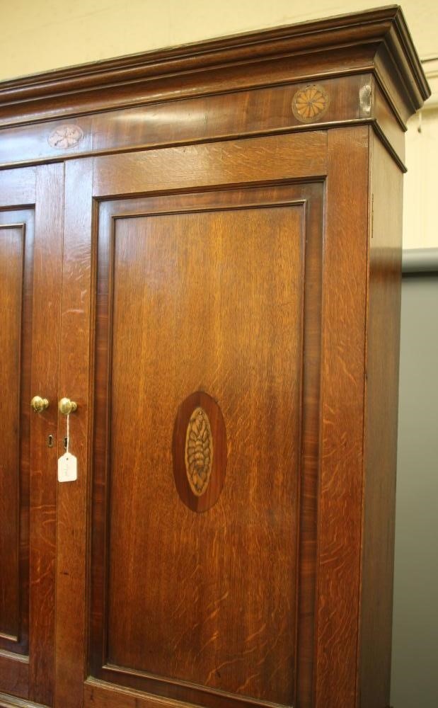 A GEORGIAN OAK TWO STAGE CUPBOARD Image