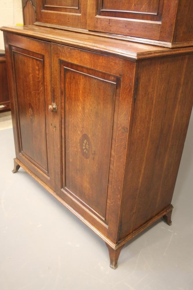 A GEORGIAN OAK TWO STAGE CUPBOARD Image