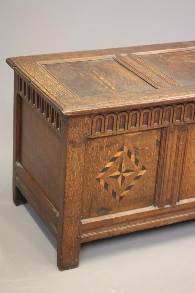 AN OAK PANELLED COFFER Image