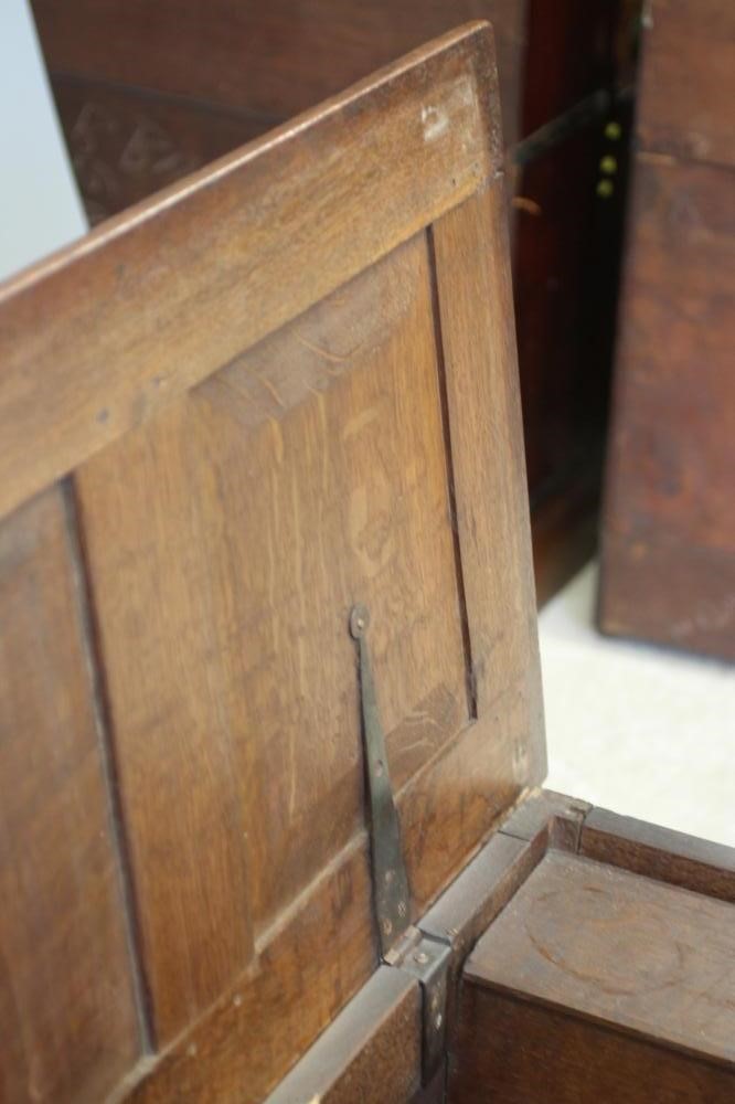 AN OAK PANELLED COFFER Image