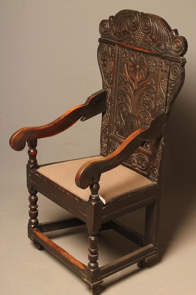A JOINED OAK ARMCHAIR Image