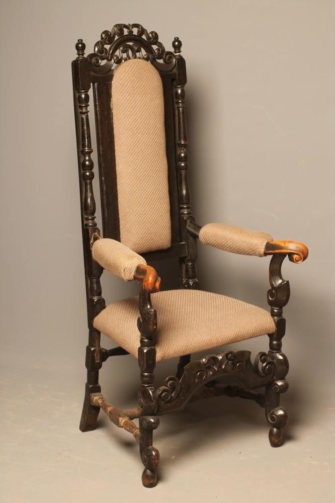 A  WALNUT ARMCHAIR Image