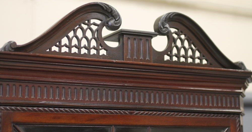 AN EDWARDIAN MAHOGANY STANDING CORNER CUPBOARD in the Georgian rococo style Image