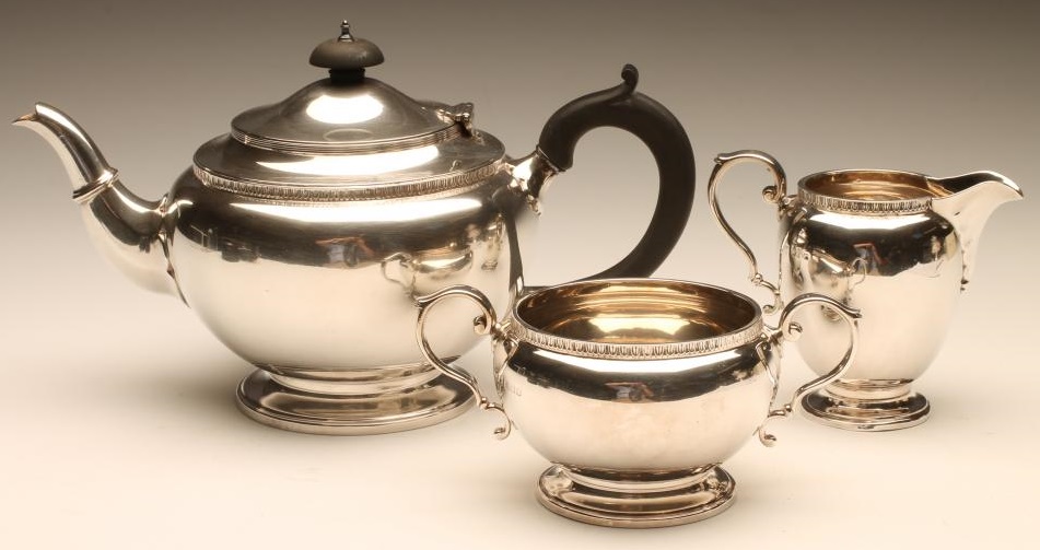 A THREE PIECE SILVER TEA SERVICE Image