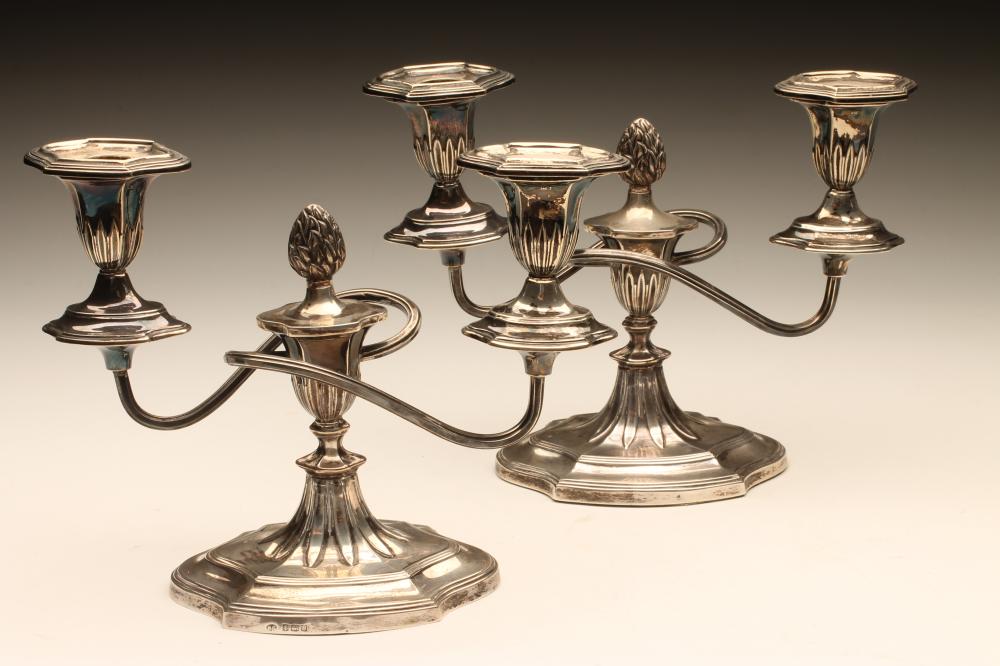 A PAIR OF SILVER DWARF CANDELABRA Image
