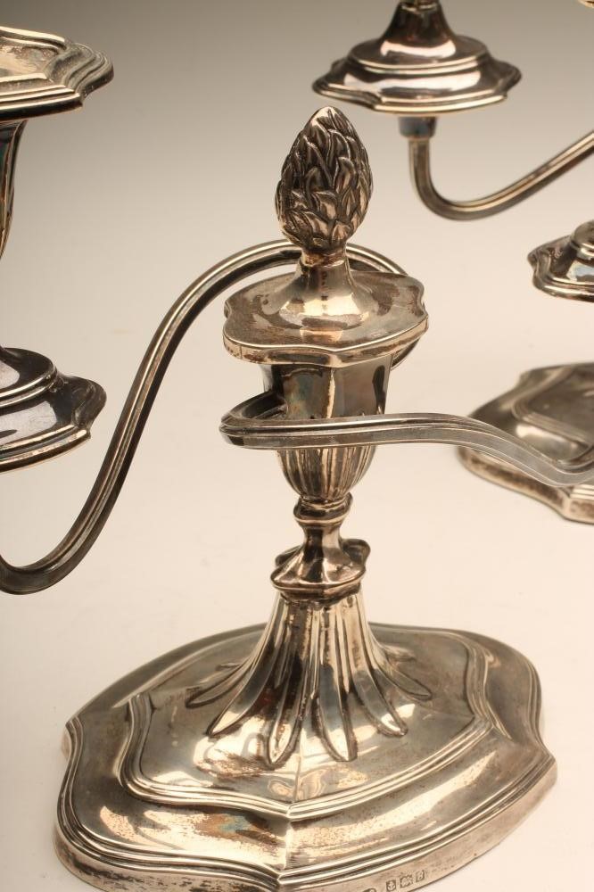 A PAIR OF SILVER DWARF CANDELABRA Image