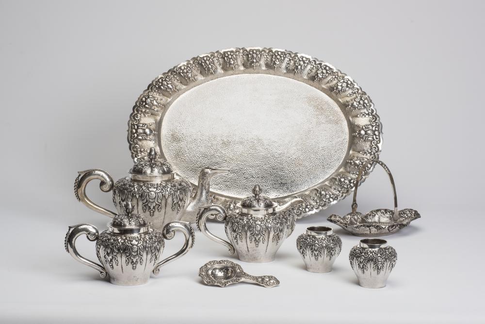 AN EXTENSIVE INDONESIAN SILVER TEA SERVICE Image