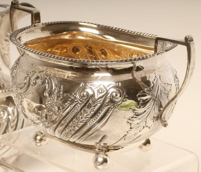 A LATE VICTORIAN FOUR PIECE SILVER TEA SERVICE Image