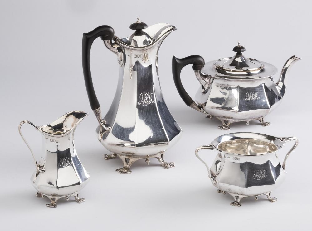 AN EDWARDIAN ARTS AND CRAFTS FOUR PIECE SILVER TEA SERVICE Image