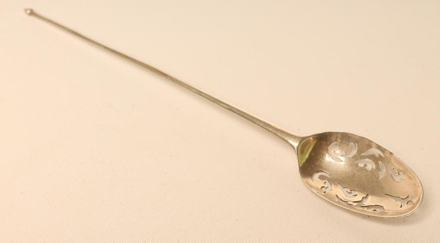 A GEORGE II SILVER MOTE SPOON Image