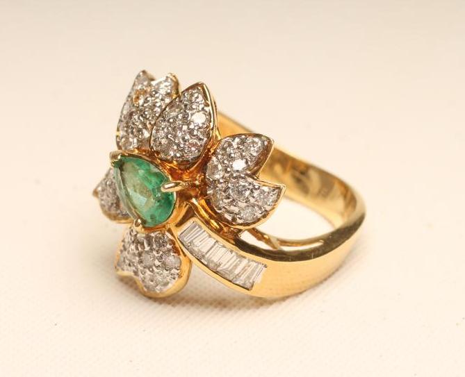 AN EMERALD AND DIAMOND COCKTAIL RING Image