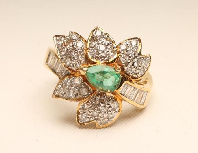 AN EMERALD AND DIAMOND COCKTAIL RING Image
