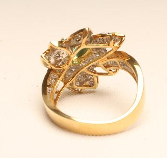 AN EMERALD AND DIAMOND COCKTAIL RING Image