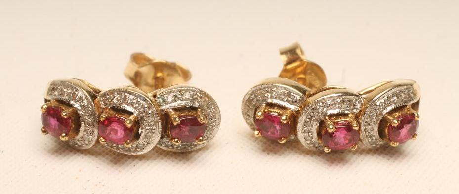 A PAIR OF RUBY AND DIAMOND STUD EARRINGS Image