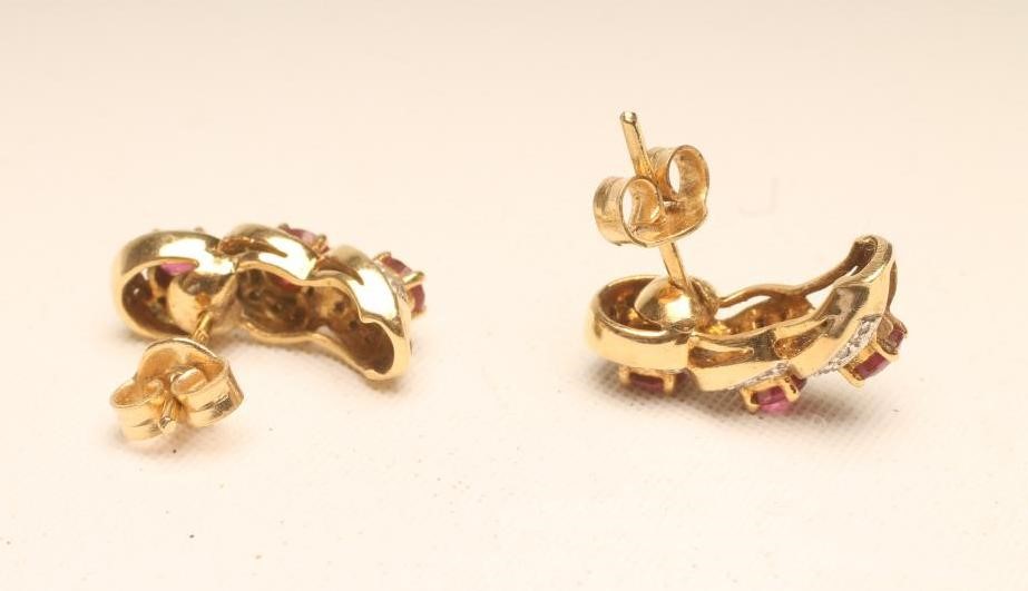 A PAIR OF RUBY AND DIAMOND STUD EARRINGS Image