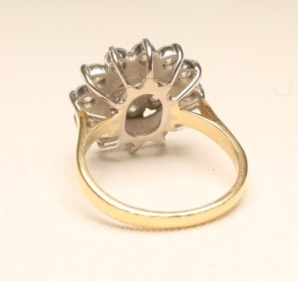 A DIAMOND CLUSTER RING Image