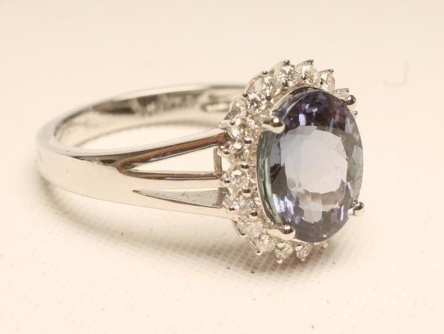 A TANZANITE AND DIAMOND RING Image