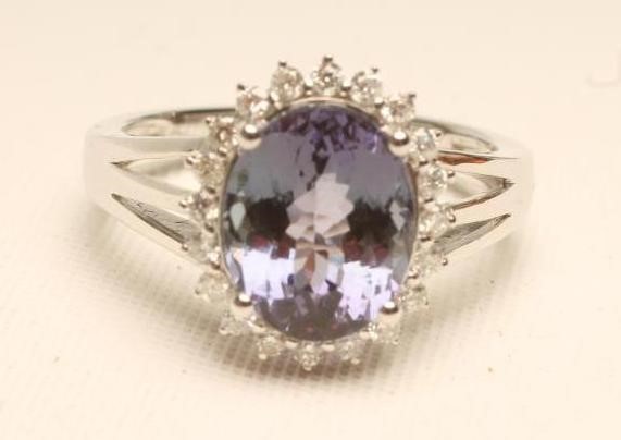 A TANZANITE AND DIAMOND RING Image