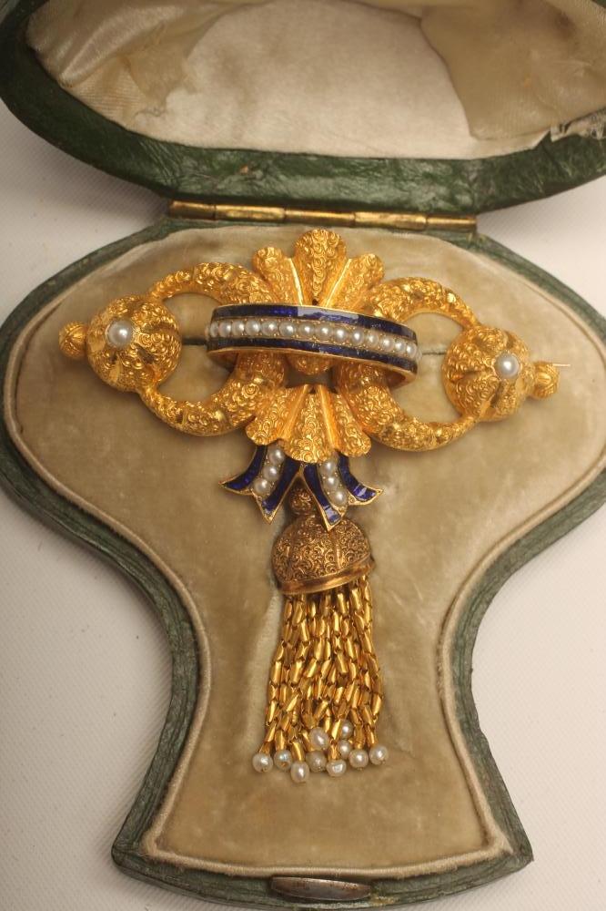 A VICTORIAN INDIANESQUE BROOCH formed as two crescents enclosing a melon lobed dome each centred by Image