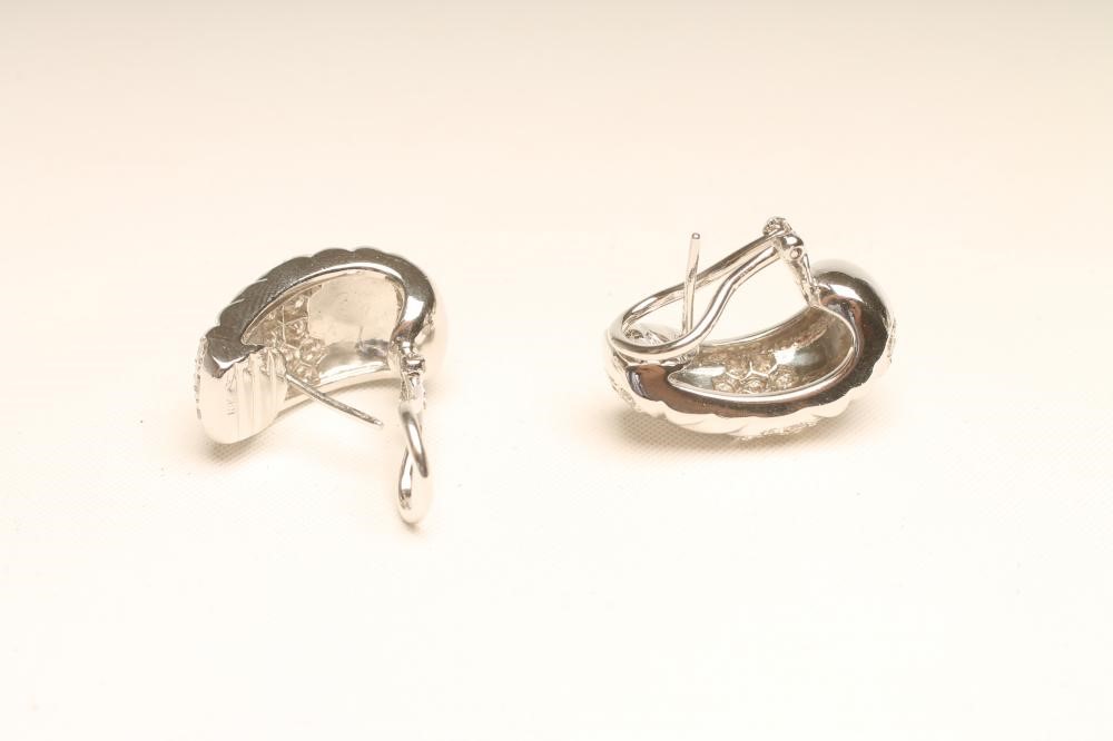 A PAIR OF DIAMOND EARRINGS Image