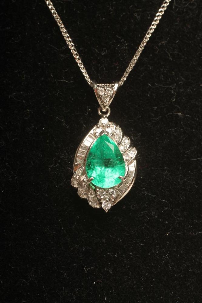 AN EMERALD AND DIAMOND PENDANT Image