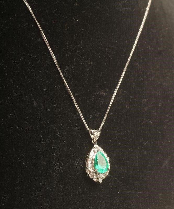 AN EMERALD AND DIAMOND PENDANT Image
