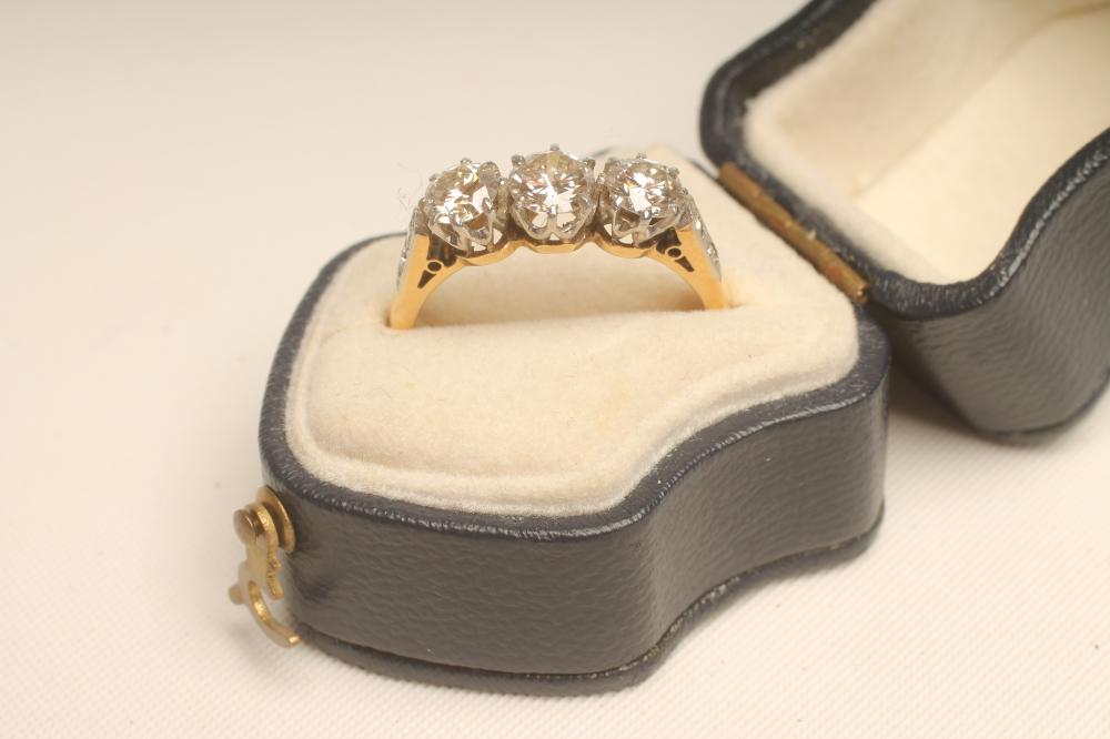 A THREE STONE DIAMOND RING Image