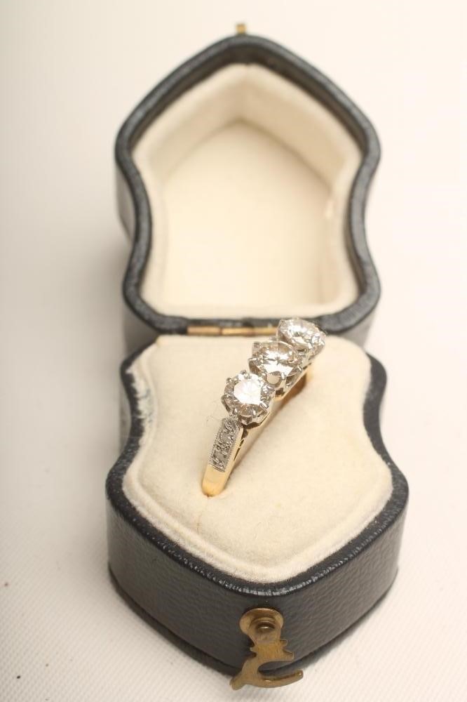 A THREE STONE DIAMOND RING Image