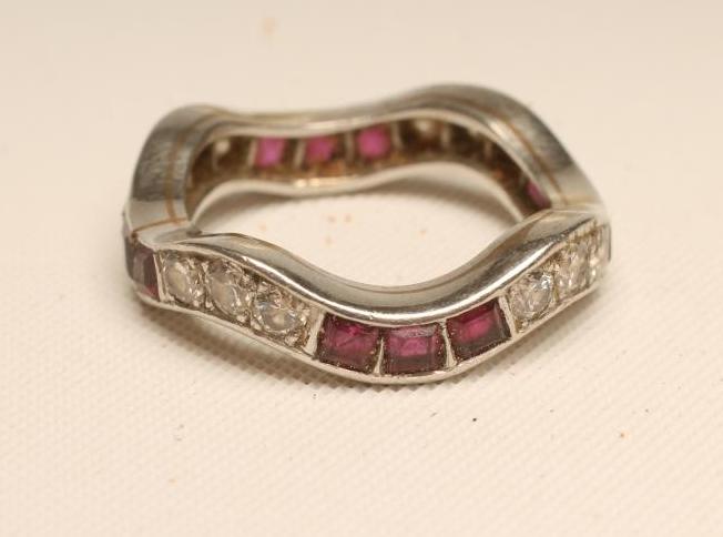 A RUBY AND DIAMOND ETERNITY RING Image