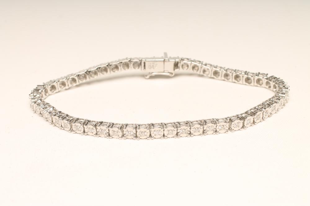A DIAMOND TENNIS BRACELET Image