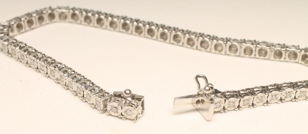 A DIAMOND TENNIS BRACELET Image