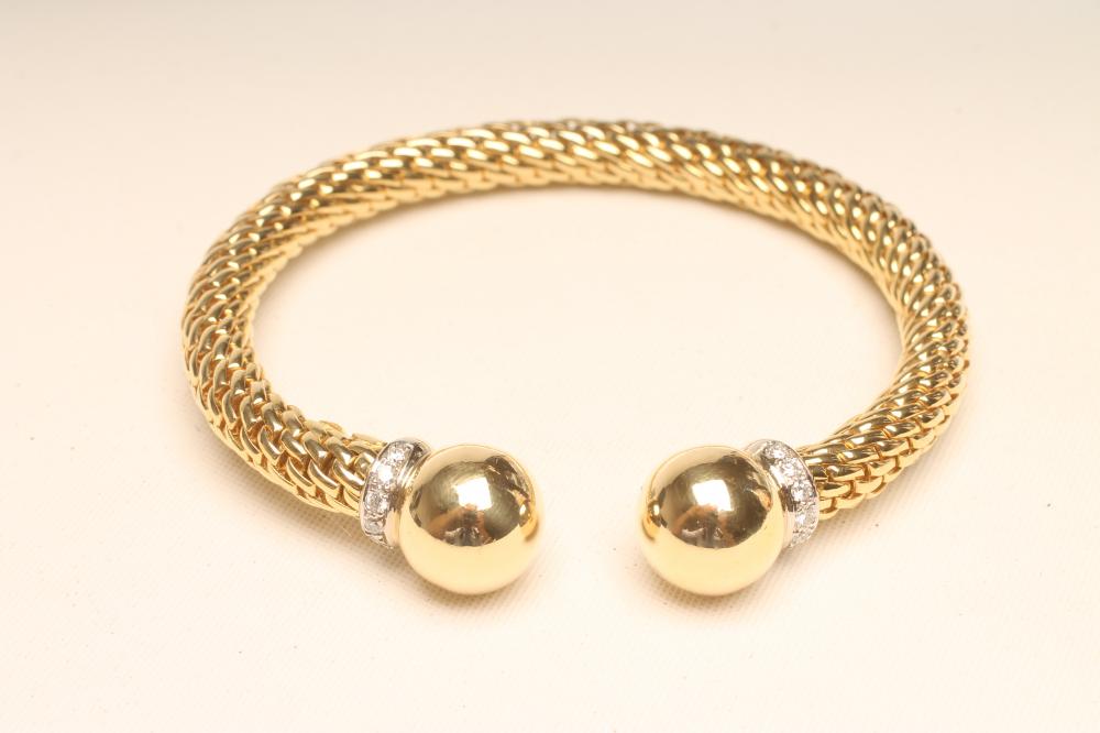 A "FOPE" 18CT GOLD TORQUE BANGLE Image
