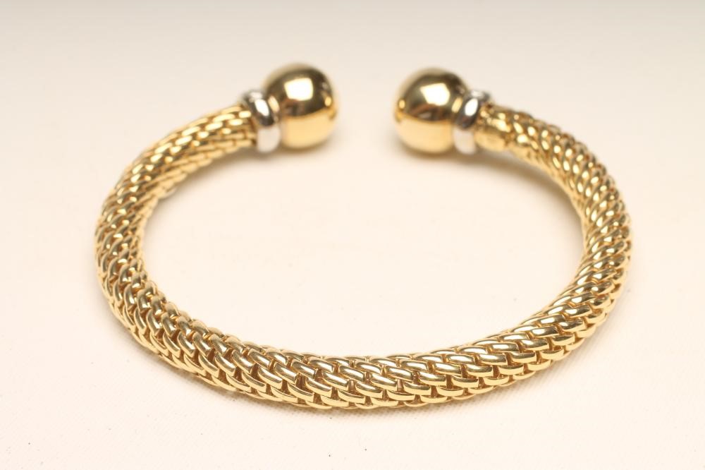 A "FOPE" 18CT GOLD TORQUE BANGLE Image
