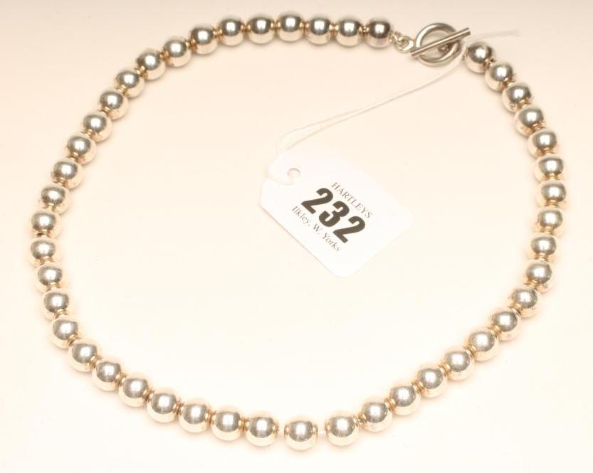 A SILVER BEAD NECKLACE Image