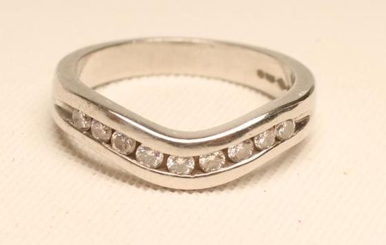 A DIAMOND HALF HOOP ETERNITY RING Image