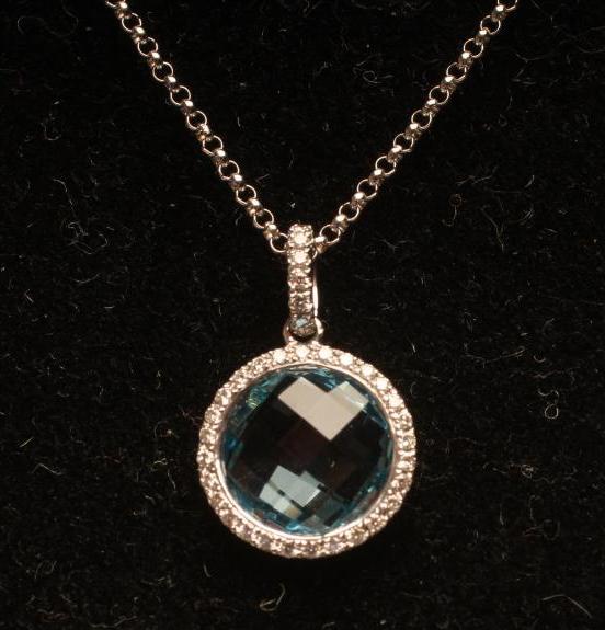A BLUE TOPAZ AND DIAMOND CLUSTER PENDANT Image