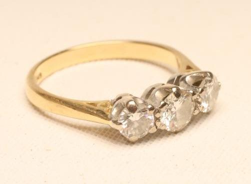 A THREE STONE DIAMOND RING Image
