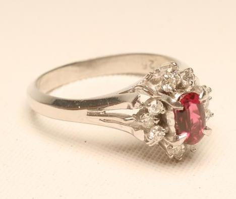A RUBY AND DIAMOND CLUSTER RING Image