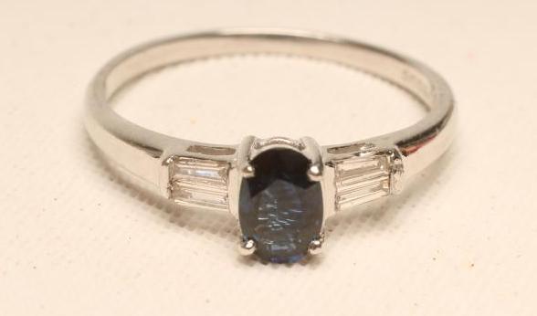 A SAPPHIRE AND DIAMOND RING Image