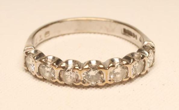 A DIAMOND HALF HOOP ETERNITY RING Image