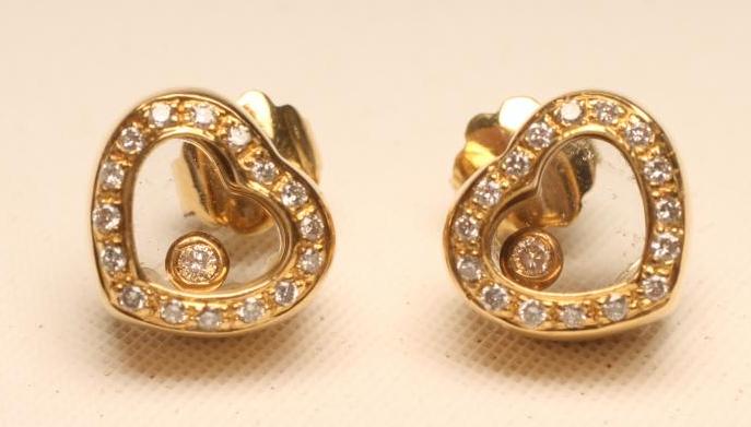 A PAIR OF DIAMOND EAR STUDS Image
