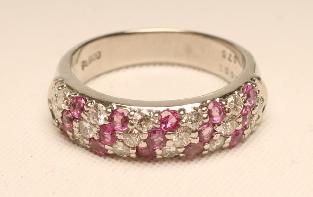 A RUBY AND DIAMOND HALF HOOP RING Image