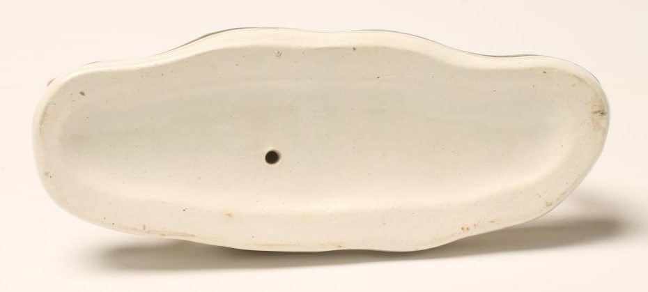 A VICTORIAN STAFFORDSHIRE POTTERY GREYHOUND Image