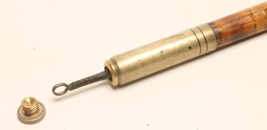 A POACHER'S WALKING stick Image