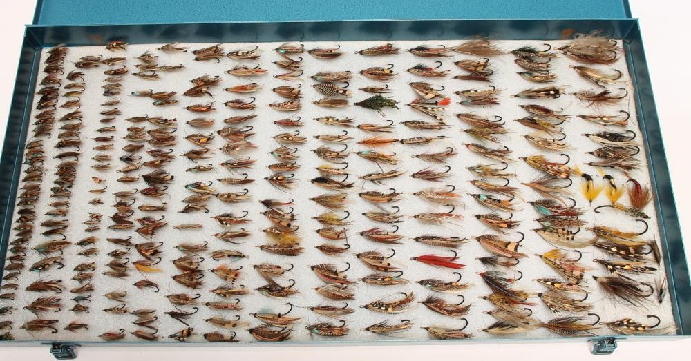 A COLLECTION OF ANTIQUE SALMON FLIES in traditional patterns contained in large metal box Image