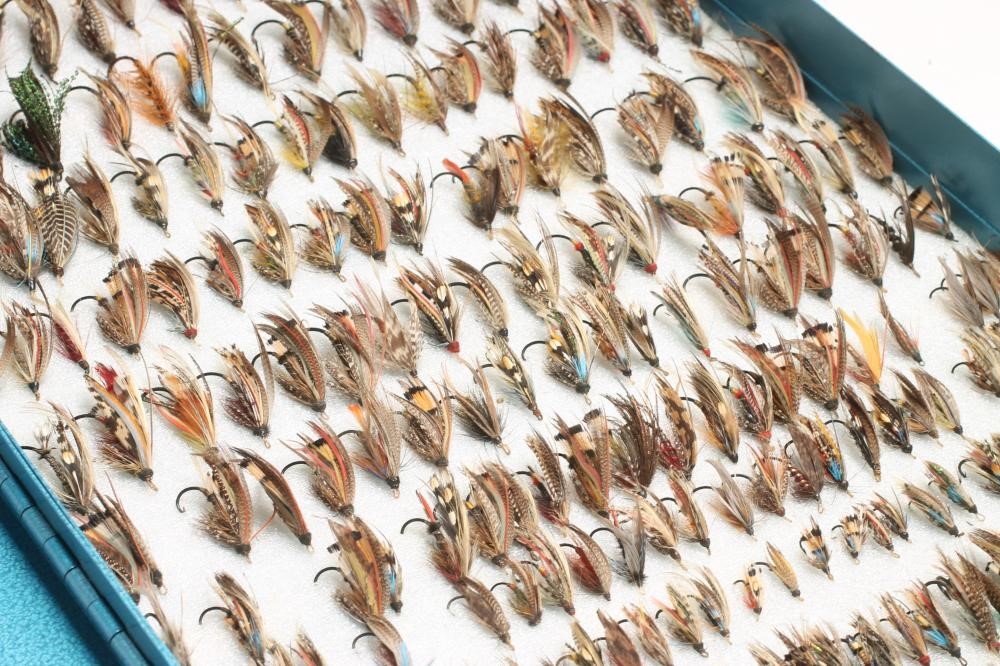 A COLLECTION OF ANTIQUE SALMON FLIES in traditional patterns contained in large metal box Image